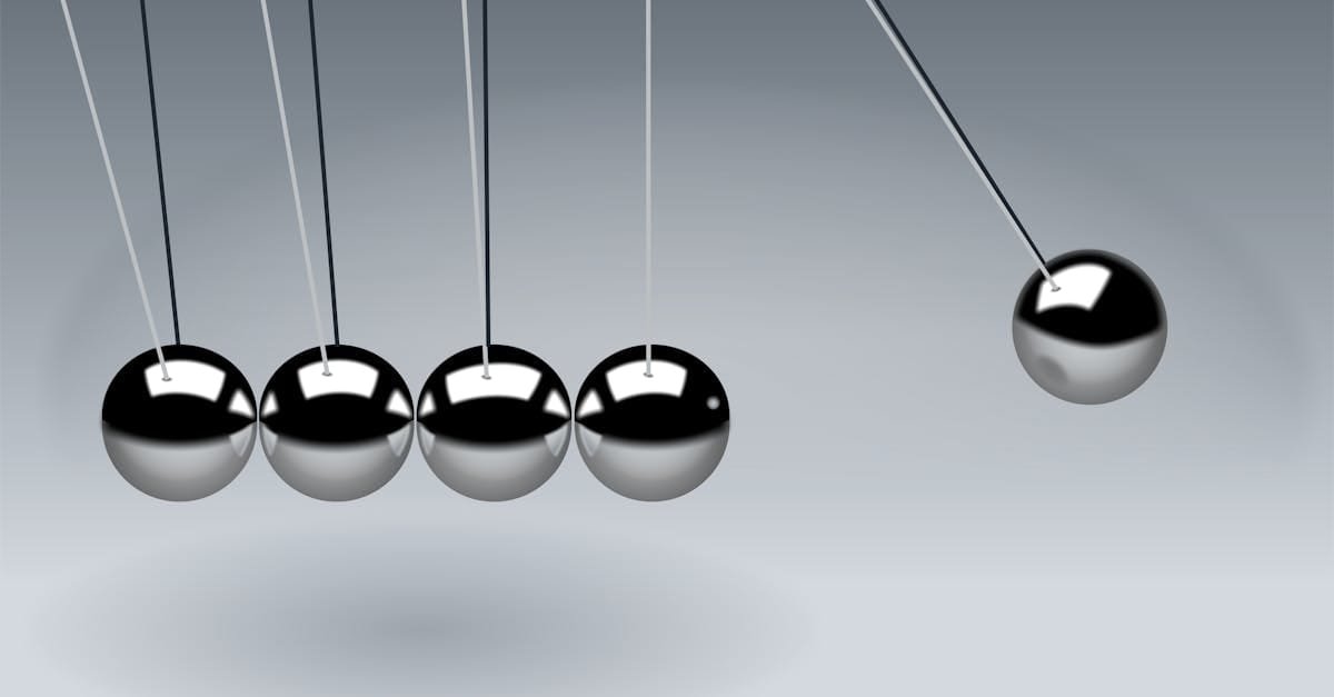 Dynamic illustration of Newton's Cradle showing motion and reflection concepts in physics.