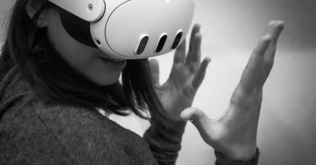 Black and white image of a woman wearing a VR headset, engaged in a virtual reality experience.