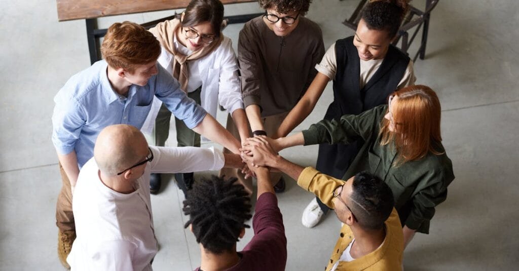 Top view of diverse group of people collaborating in office setting.