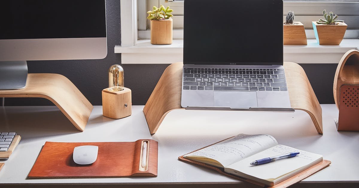 A stylish and contemporary home office setup with laptop and desk accessories.