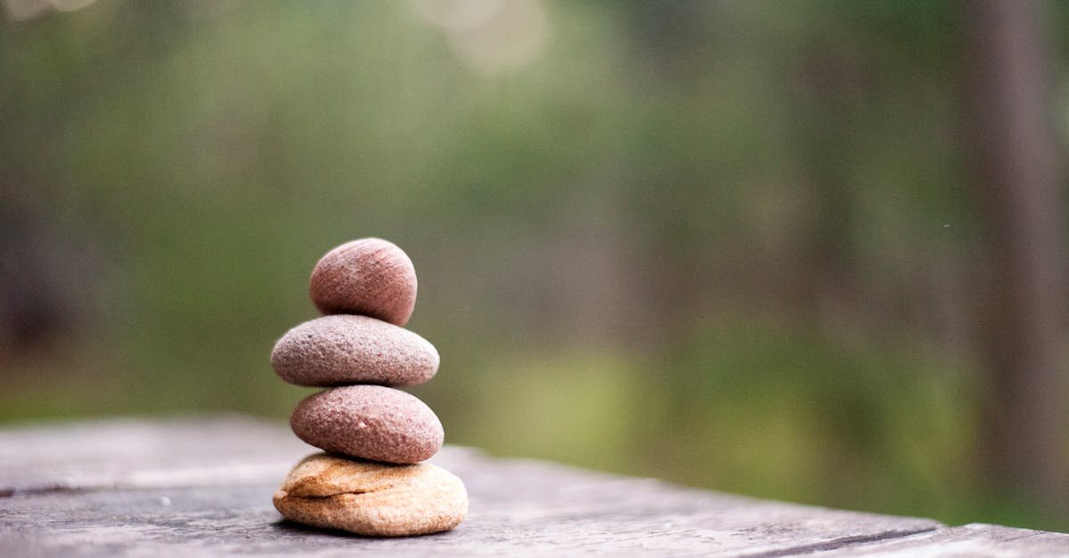 Balance and tranquility embodied by stacked stones in a natural outdoor setting.