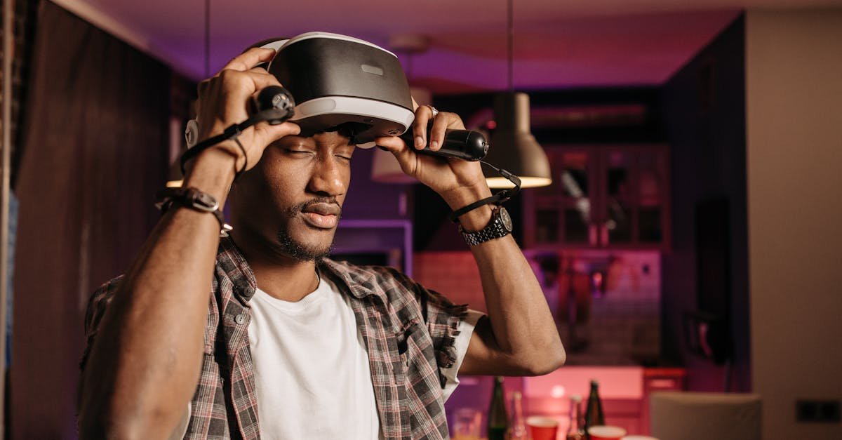 Young adult enjoying virtual reality gaming indoors with VR headset.