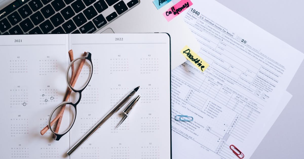 Organized workspace featuring a calendar, tax documents, and planner essentials.