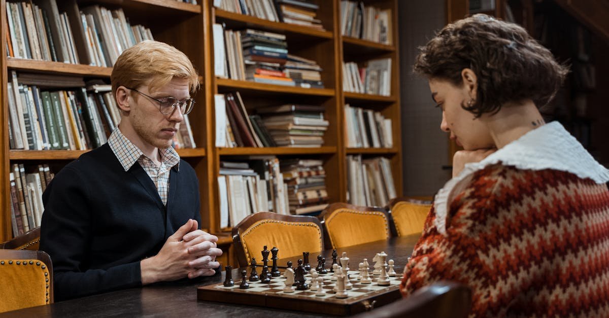 Two adults playing chess in a cozy library setting, embodying strategy and intelligence.