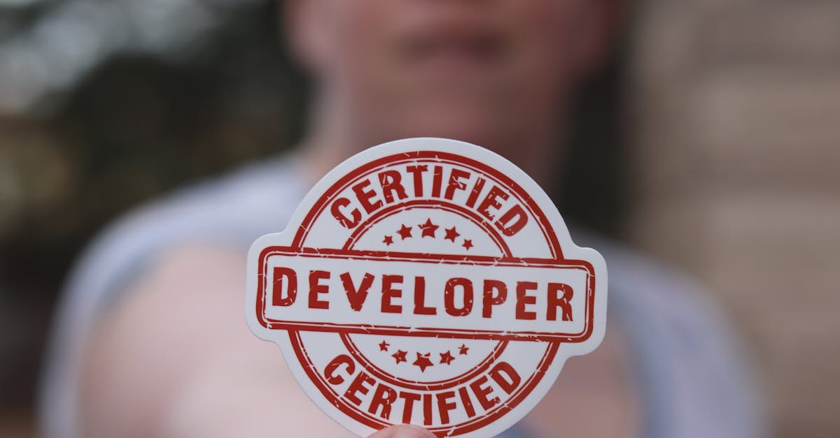 Close-up of a certified developer badge being held outdoors.