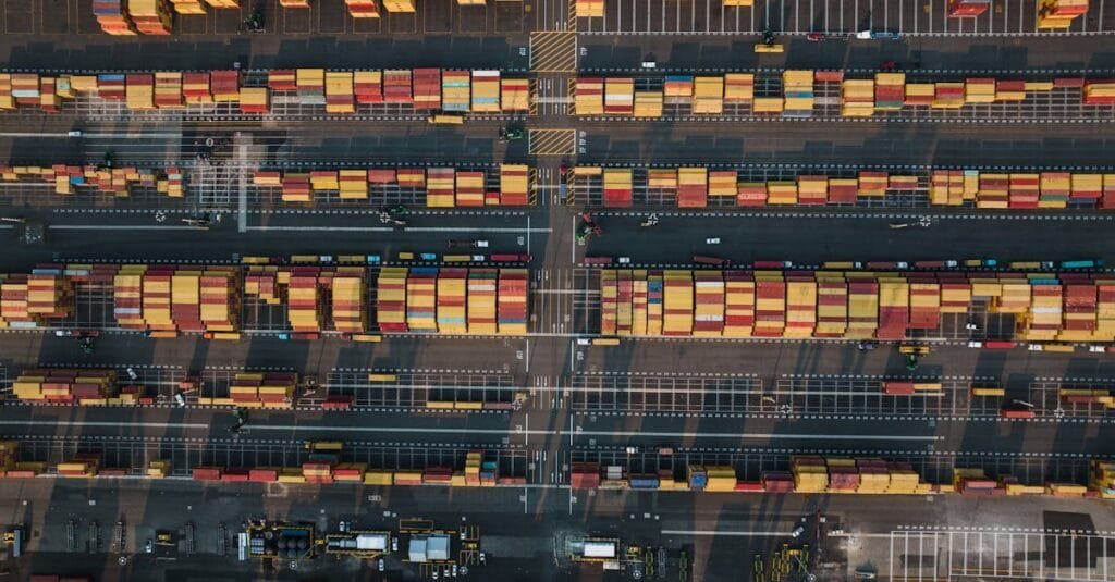 Drone shot of a bustling shipping container terminal in Seattle, showcasing vibrant industry activity.