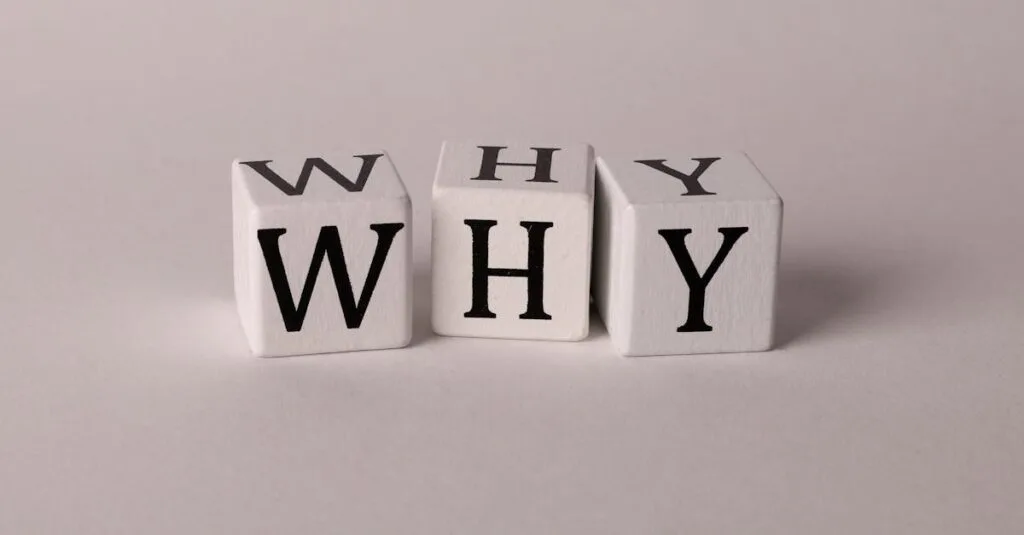 Close-up of lettered dice spelling 'WHY' on a neutral background, ideal for concepts of inquiry or curiosity.