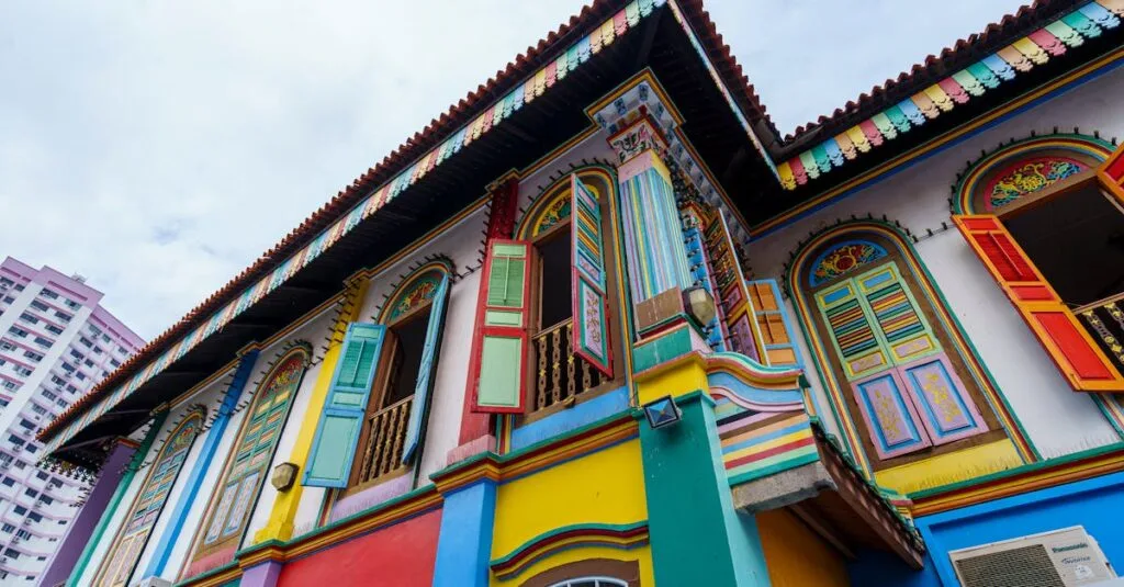 Colorful traditional house in Singapore's Little India, showcasing vibrant architecture with ornate window shutters.