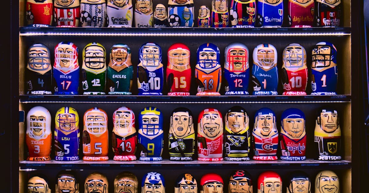 Colorful nesting dolls depicting various sports teams displayed on shelves.