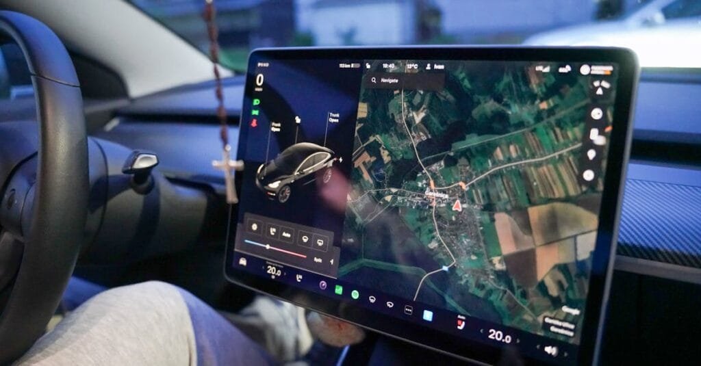 Close-up of a car's digital dashboard displaying GPS navigation in Garešnica, Croatia.