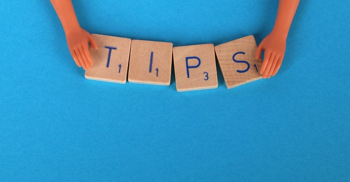 Scrabble tiles spelling 'TIPS' on a blue background, ideal for creative concepts.