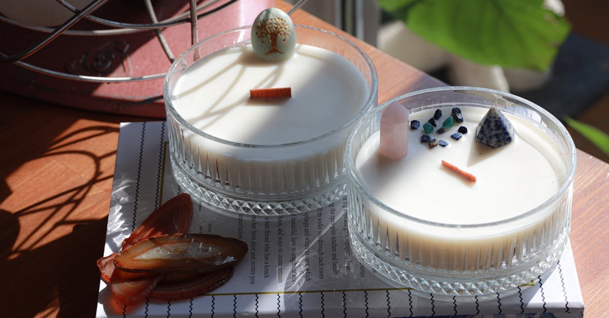 Two exquisite homemade candles decorated with artistic elements, perfect for home decor inspiration.