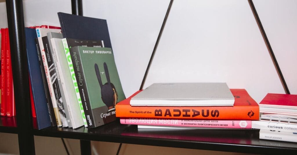 A variety of hardcover books neatly arranged on a modern bookshelf indoors.