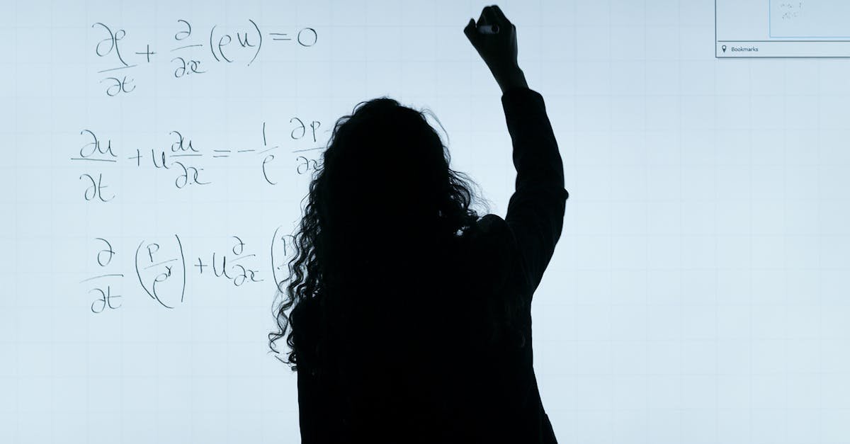 A silhouette of a woman writing mathematical equations on a large whiteboard, representing education and analysis.