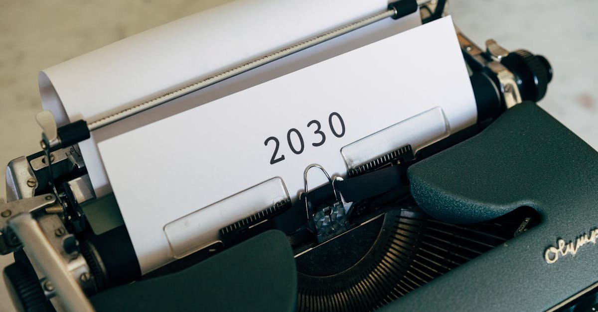 Close-up of a vintage typewriter with the year 2030 typed on paper symbolizing future concepts.