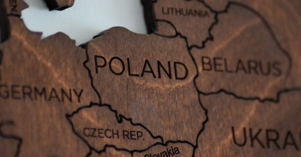 Detailed wooden map featuring Poland and surrounding countries.