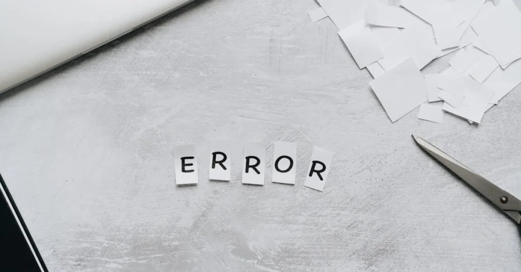 Creative concept showing the word 'error' with cut out letters on a table with scissors and paper.