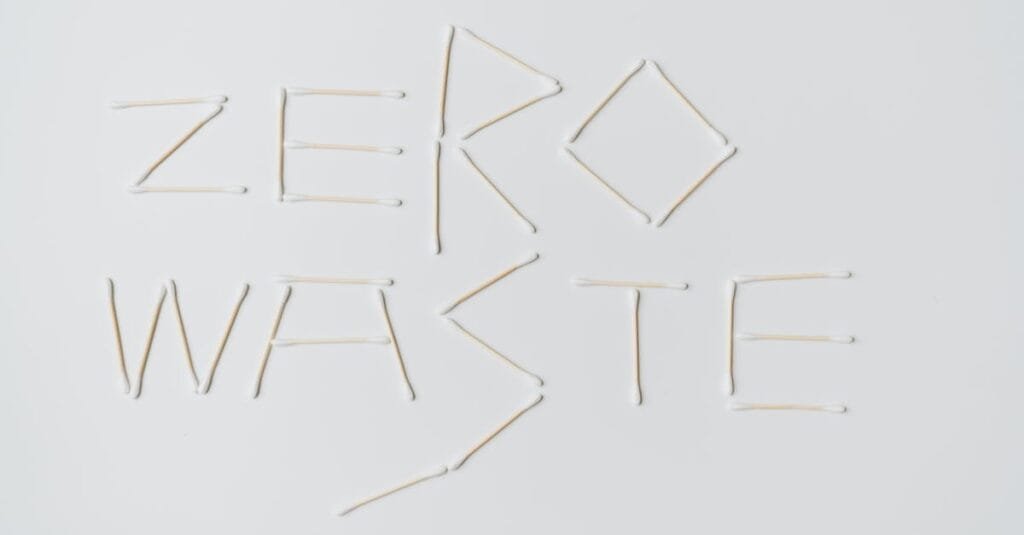Creative layout of zero waste sign formed with cotton swabs on a white background.