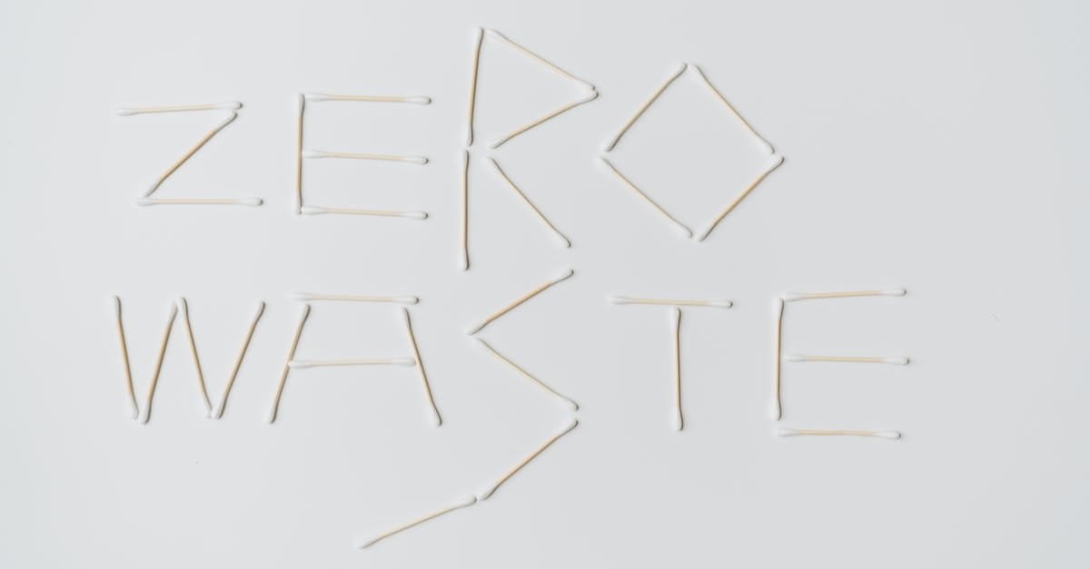 Creative layout of zero waste sign formed with cotton swabs on a white background.