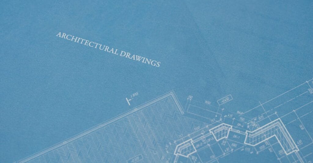 Close-up view of architectural blueprint with technical drawings.