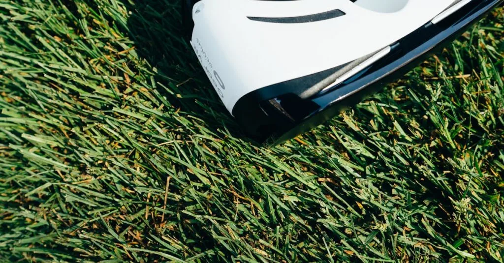 A close-up shot of VR goggles placed on a green grass lawn under sunlight.
