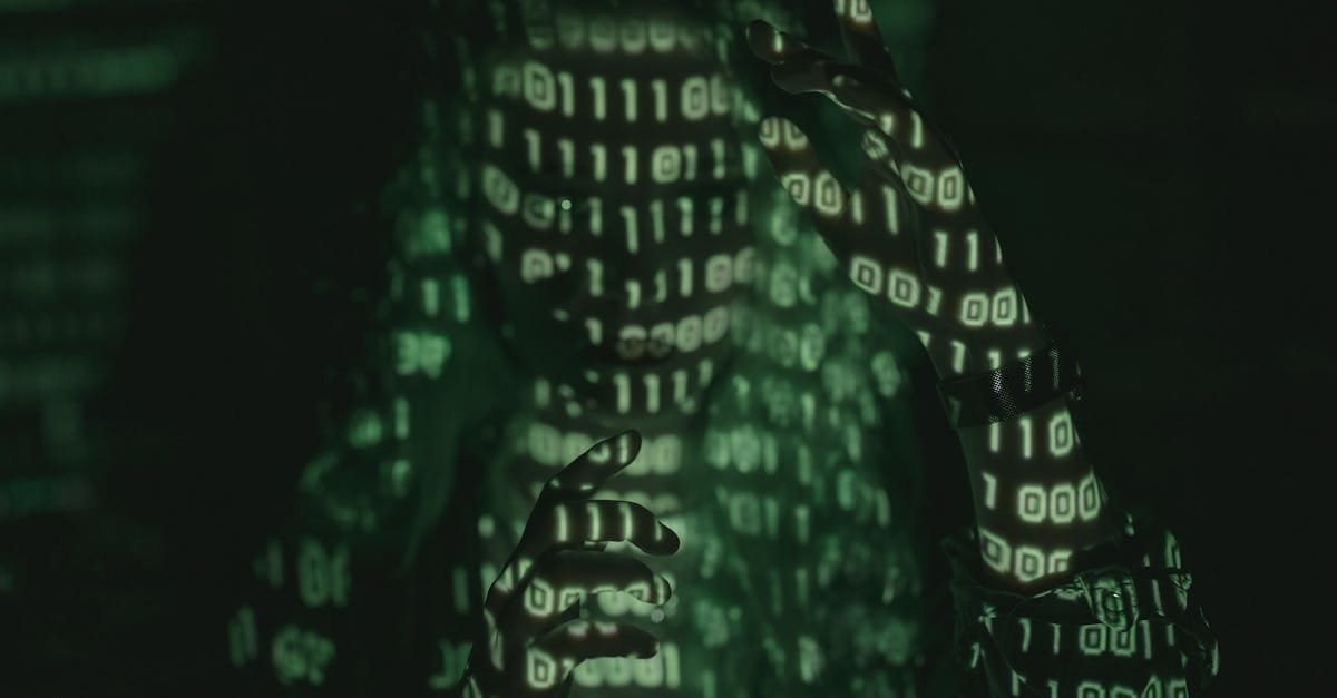 An unrecognizable person with binary code projected, symbolizing cybersecurity and digital coding.