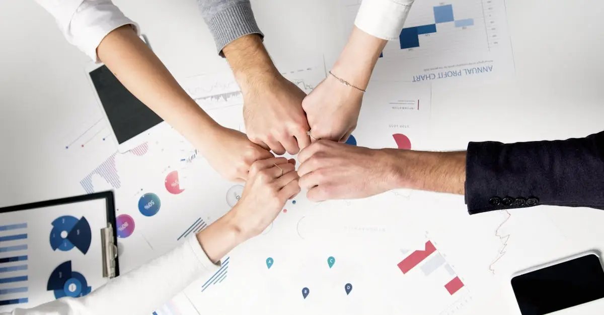 Colleagues celebrate success with a fist bump over financial charts depicting teamwork and unity.