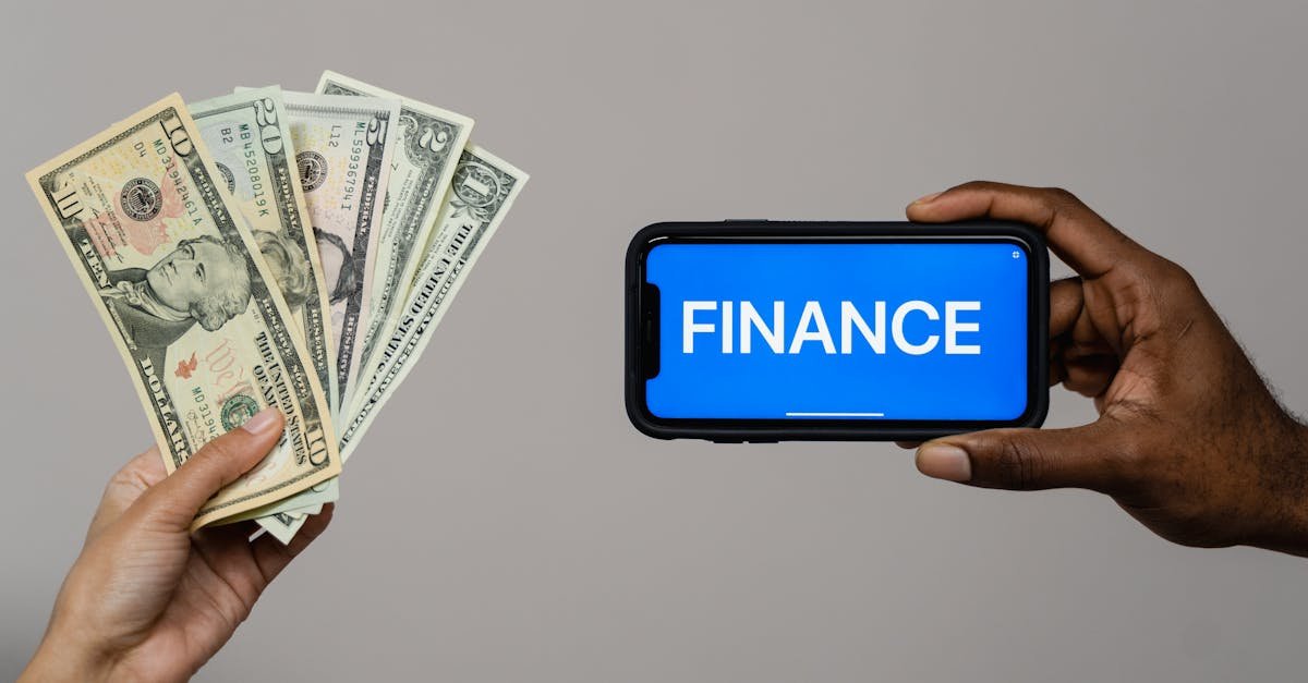 Image depicting currency and finance concept with hands holding cash and a smartphone.
