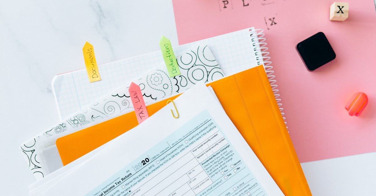 Overhead view of tax documents, forms, and organized work area for tax preparation.