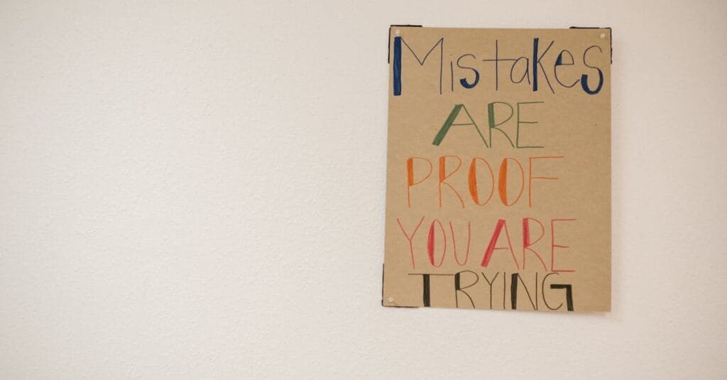 A motivational poster with the phrase 'Mistakes are proof you are trying.'