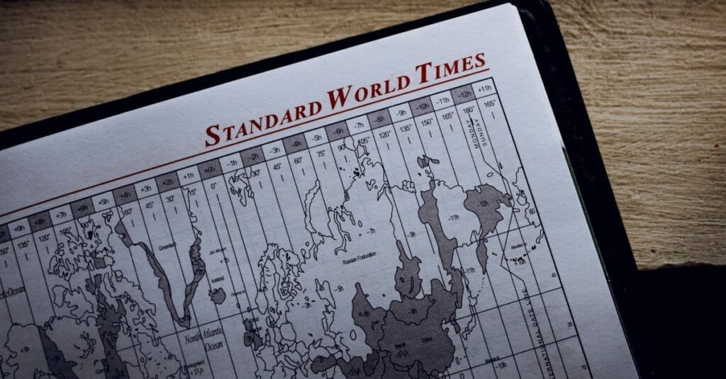 Close-up view of a world time zone map printed on paper inside a diary.