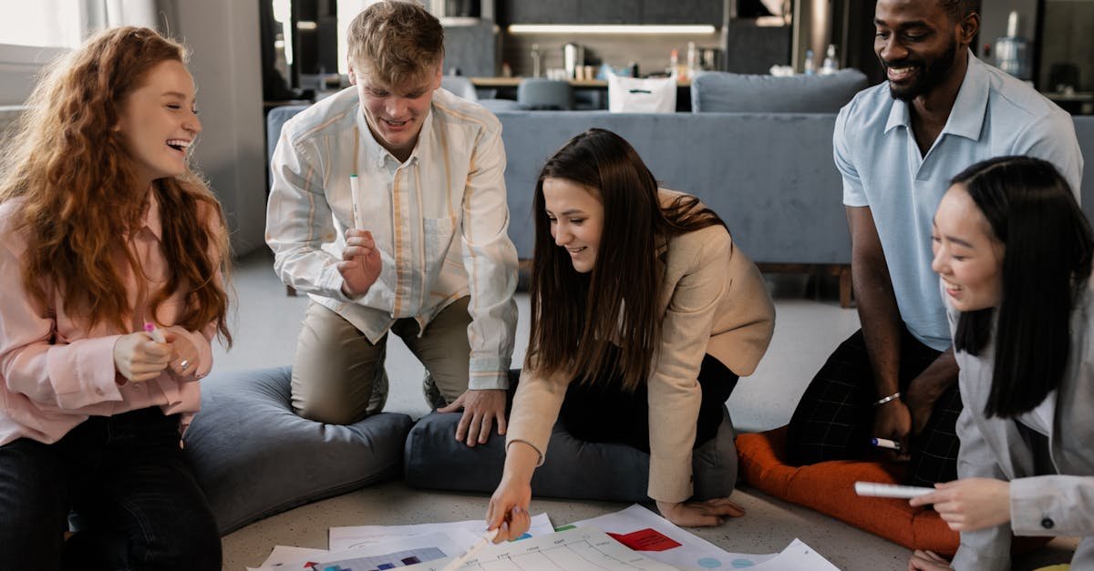 A diverse group of professionals collaborating on a project in a modern office setting.