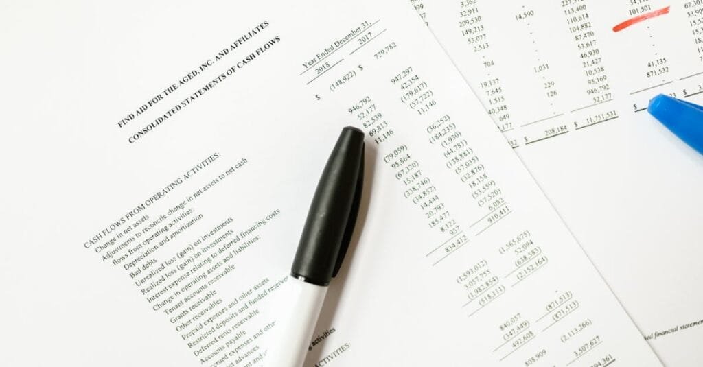 Financial documents featuring cash flows and pens, ideal for business themes and analysis.