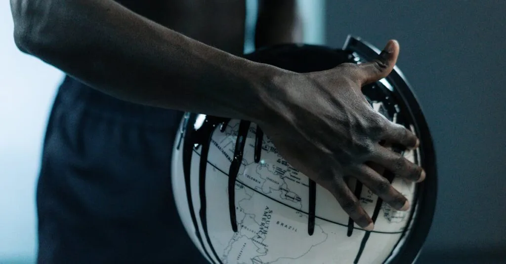 A hand holding a globe dripping with oil, symbolizing pollution and fossil fuels.