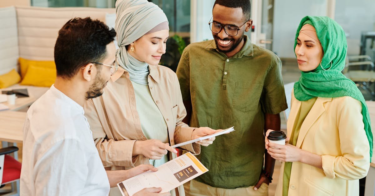 A diverse group of professionals engaged in a collaborative meeting in a modern office setting.