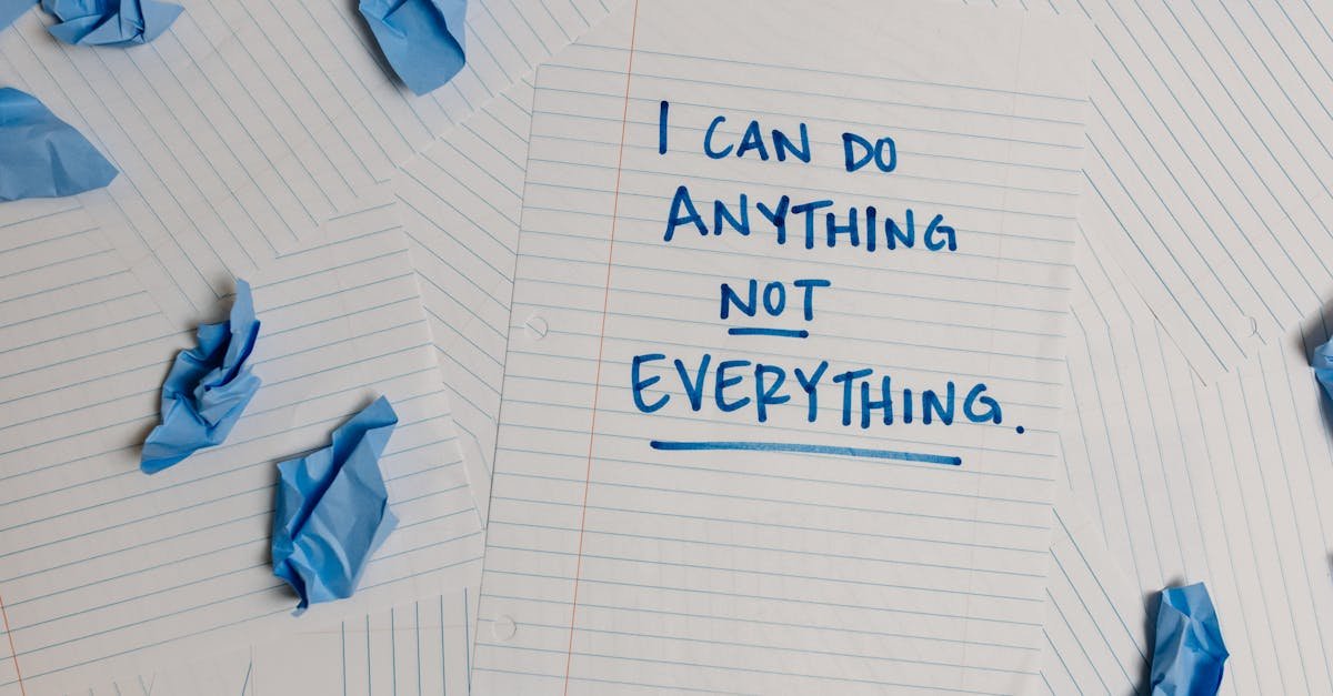 Inspirational note on paper with crumpled blue pages around, ideal for motivation concepts.