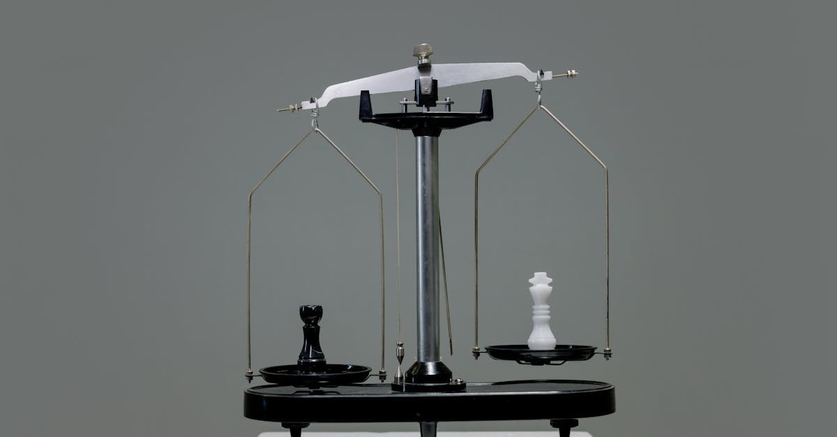 Chess pieces balanced on a scale depicting equality or strategy in decision making.