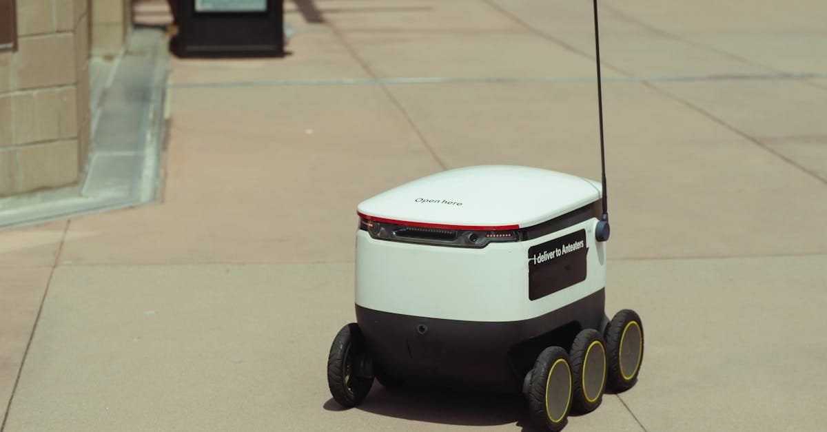Futuristic autonomous delivery robot navigating a city sidewalk on a sunny day.