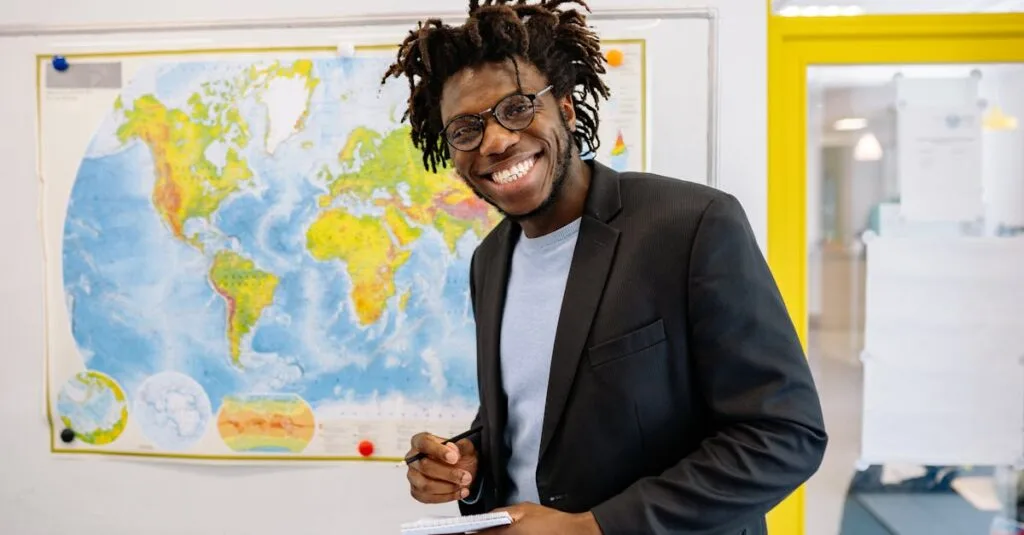 Energetic teacher smiling in front of a world map, holding a notepad, wearing eyeglasses.