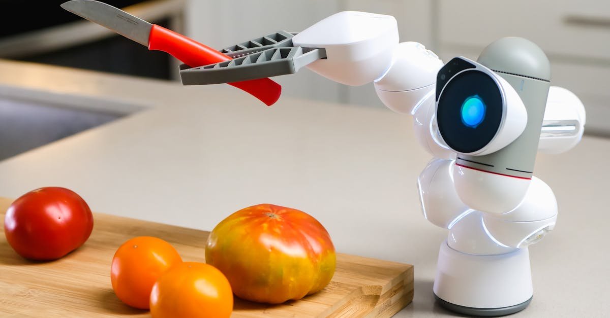 Innovative robot using a knife on a wooden board with various tomatoes in a modern kitchen setting.
