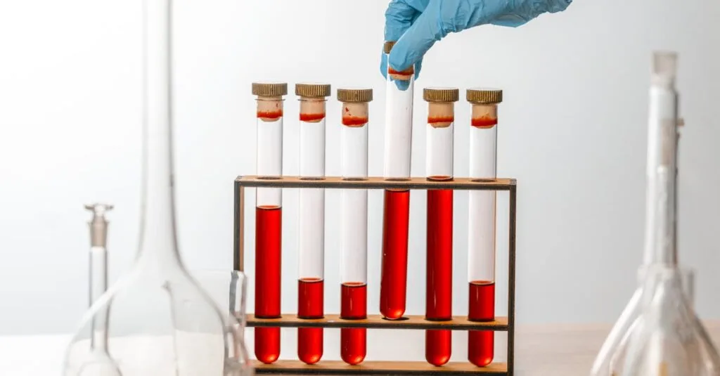 Close-up of gloved hand handling test tubes in a scientific laboratory setting.