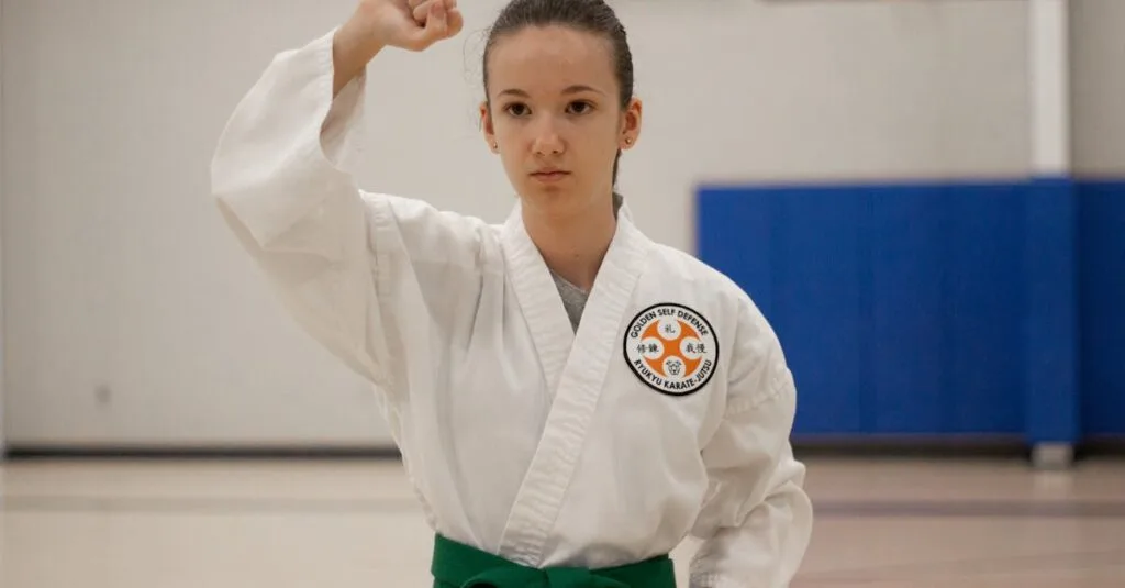 A young girl in a martial arts dojo practicing karate, wearing a green belt and a karategi.