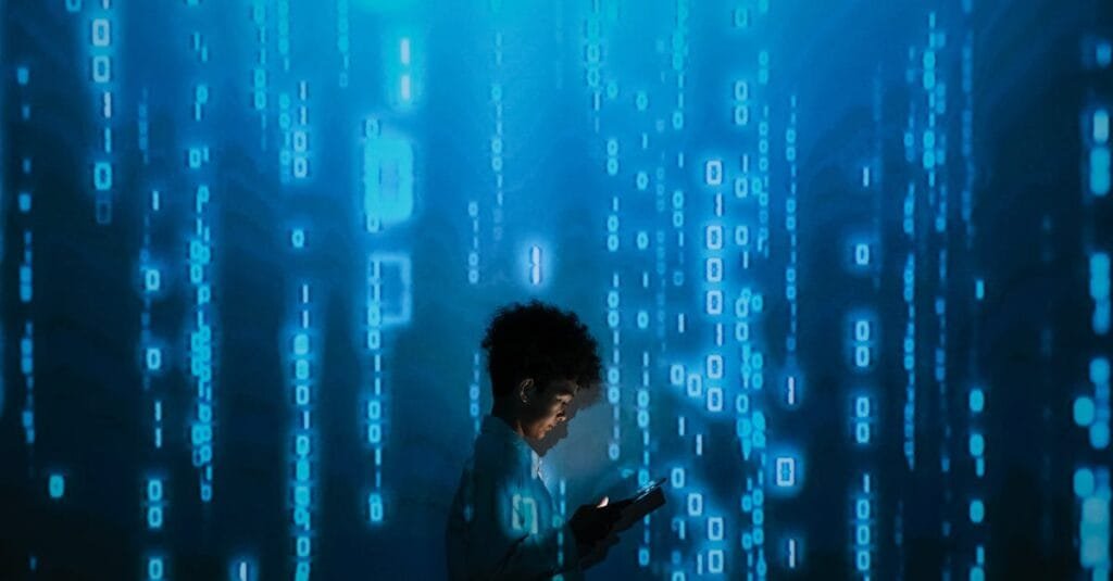 Silhouette of a person using a smartphone surrounded by digital binary code projections.