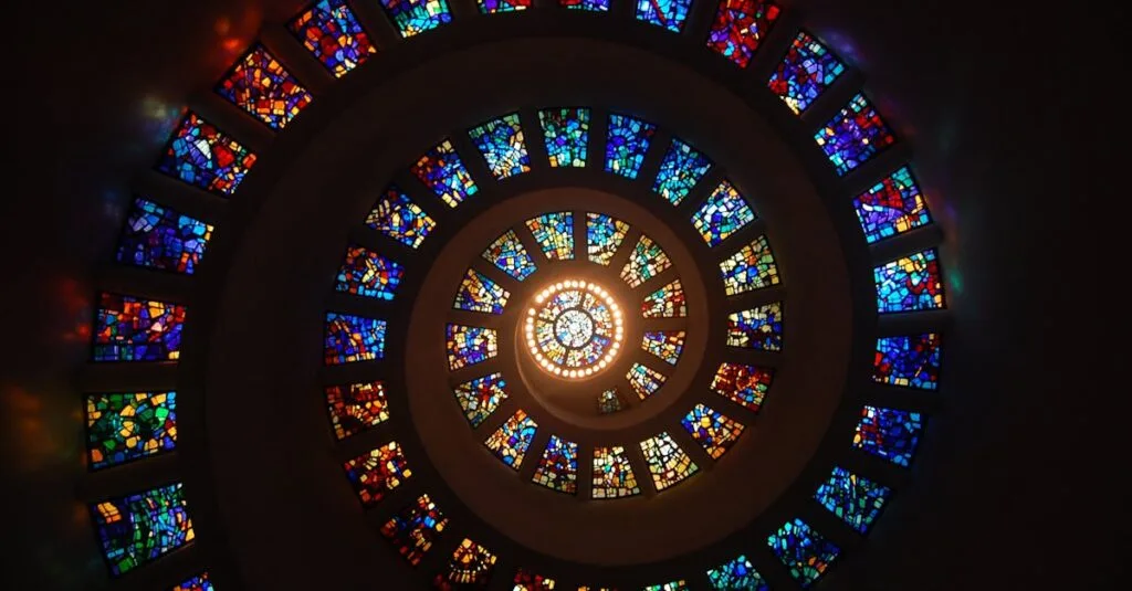 Captivating spiral stained glass art with vibrant colors forming a dramatic eye-catching pattern.