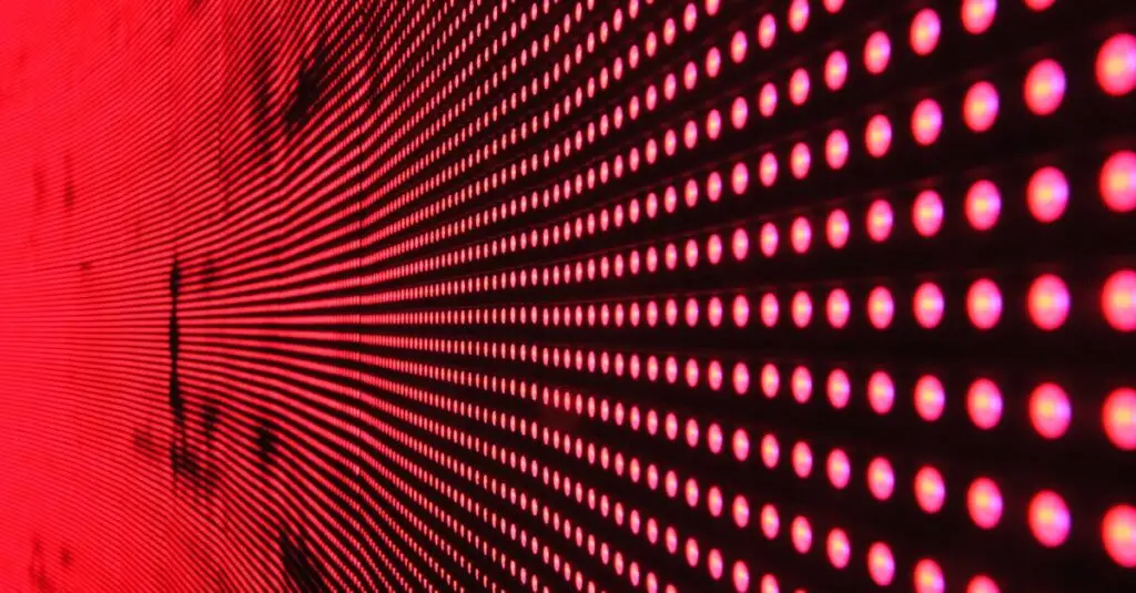 Vibrant abstract pattern of illuminated red LED lights forming a dynamic design.