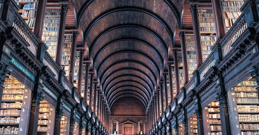 Explore the majestic architecture of an ancient library with classic wooden arches and towering book-filled shelves.