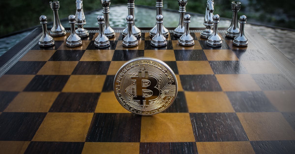 Bitcoin coin standing on a chessboard with silver and brass chess pieces. Concept of strategic digital currency investment.