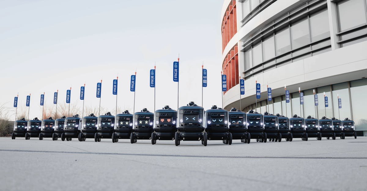 A fleet of delivery robots aligned outside a modern building, illustrating futuristic technology.