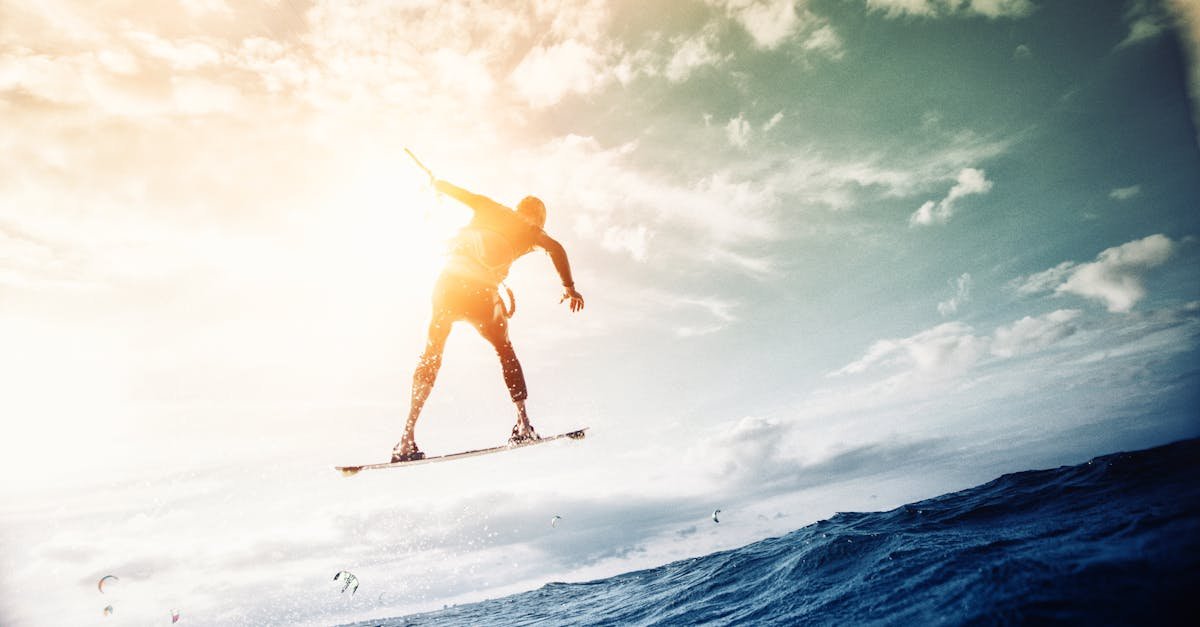 Exciting wakeboarding jump against a sunny sky over the ocean waves in Kiel, Germany.