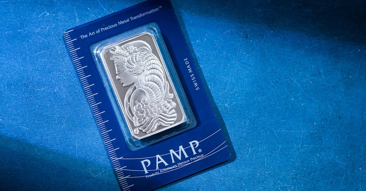High-quality silver PAMP bar on a striking blue background, emphasizing luxury and security.